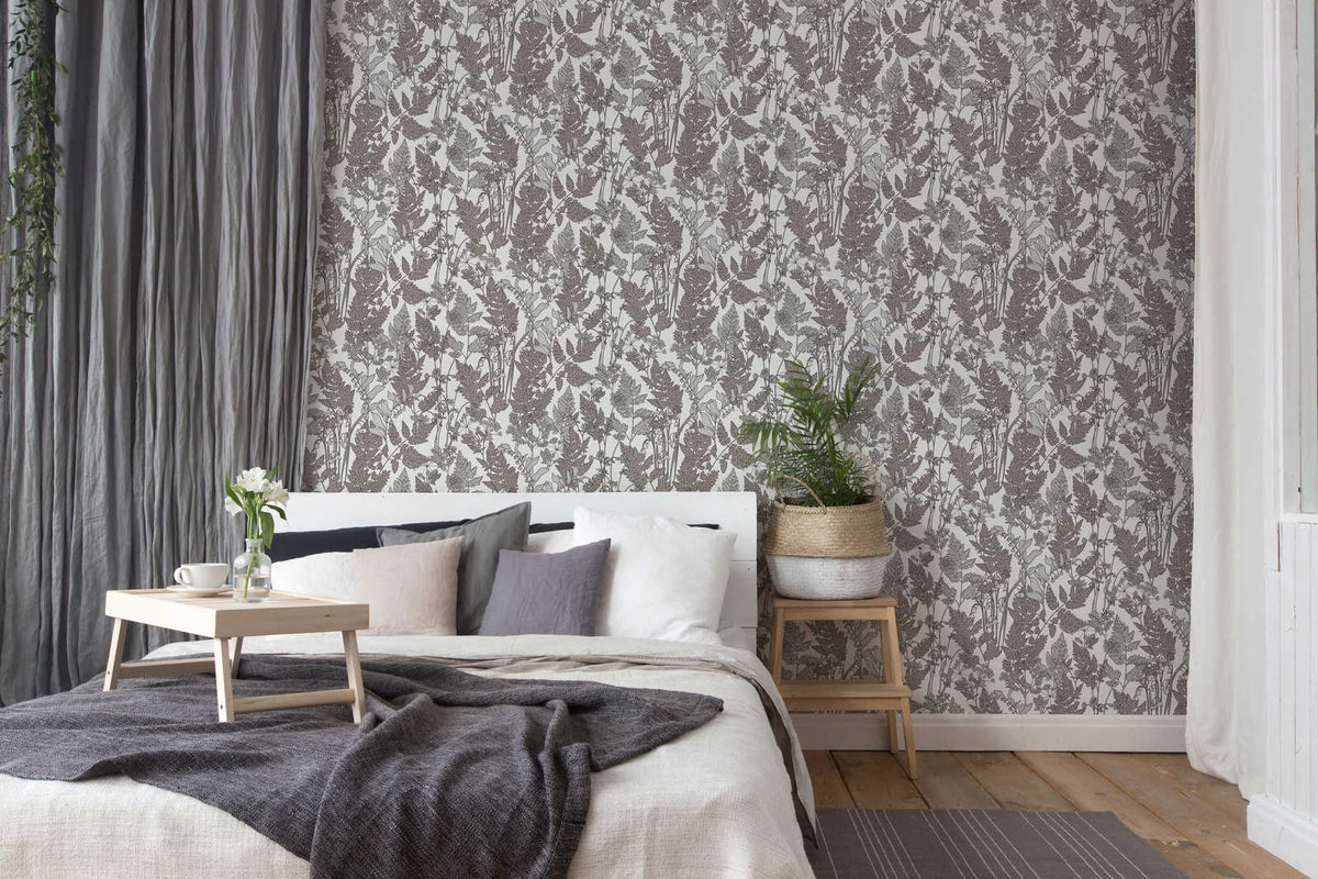 The Bracken Folio | Mocha Grey Luxe wallpaper hung behind a bed with grey curtains and plum bedding in a bedroom