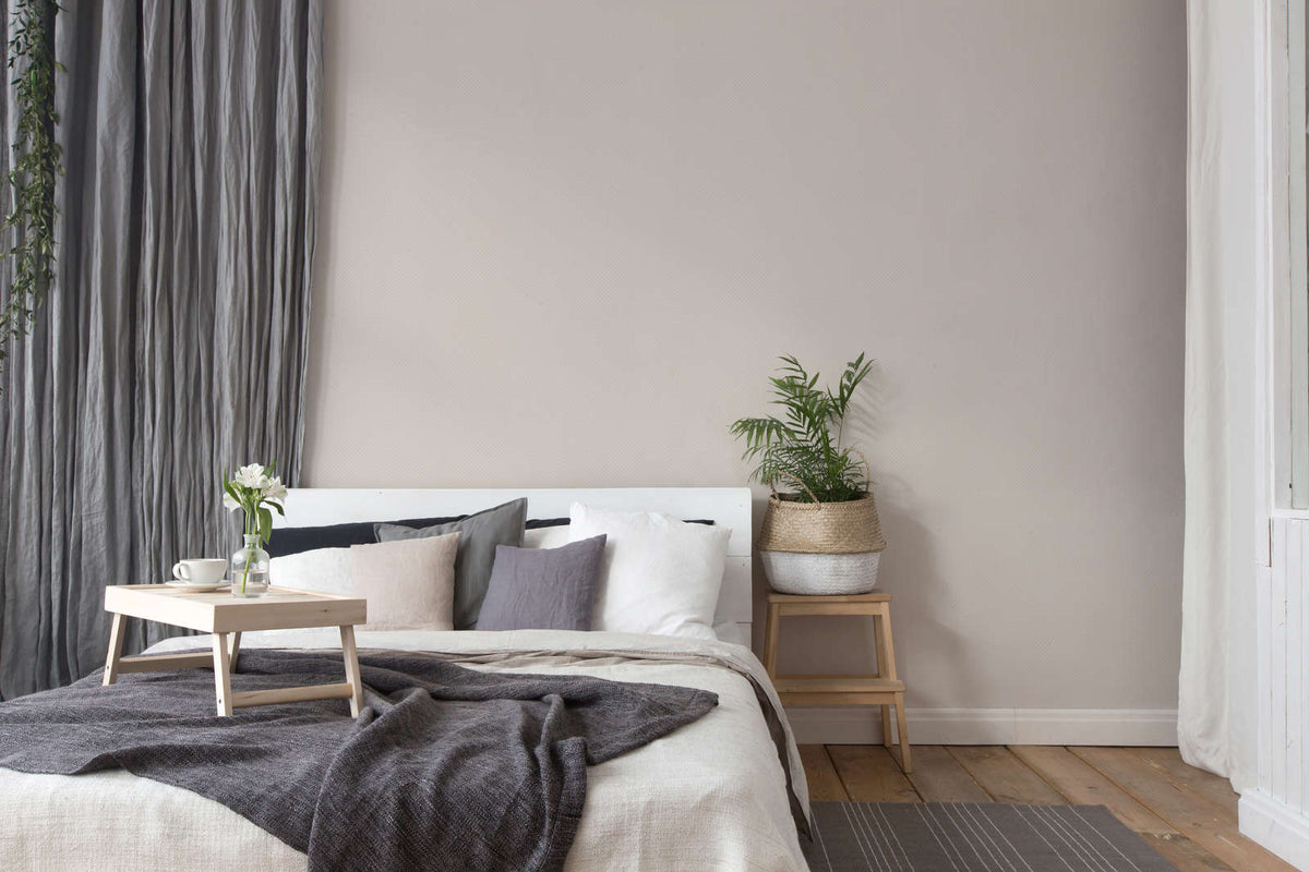 The Cartouche Landing | Warm Beige & Cream Luxe wallpaper shown hung on a styled interior wall (official room photo)