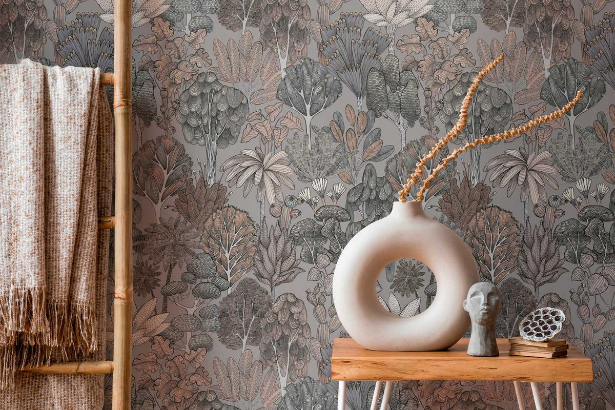 The Understory Atelier | Taupe Grey Luxe wallpaper behind a wooden side table with a sculptural vase and knit throw