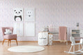 The Meander Court | Blush & Violet Luxe wallpaper shown hung on a styled interior wall