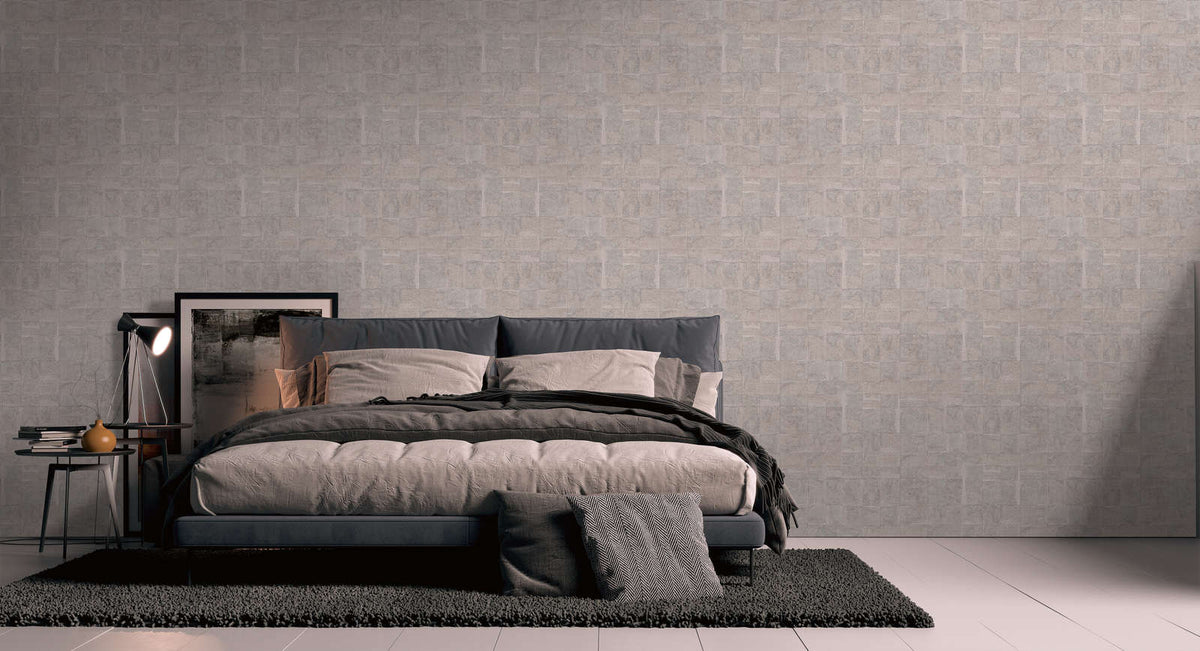 The Mosaic Cloister | Mauve Silver Luxe wallpaper hung behind a low bed with dark bedding in a bedroom