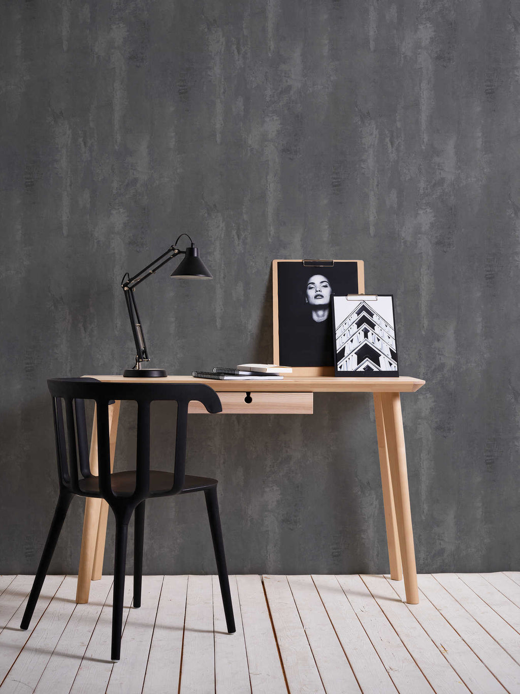 The Basalt Foundry | Charcoal Slate Luxe wallpaper behind a timber desk with a black chair and task lamp in a home office