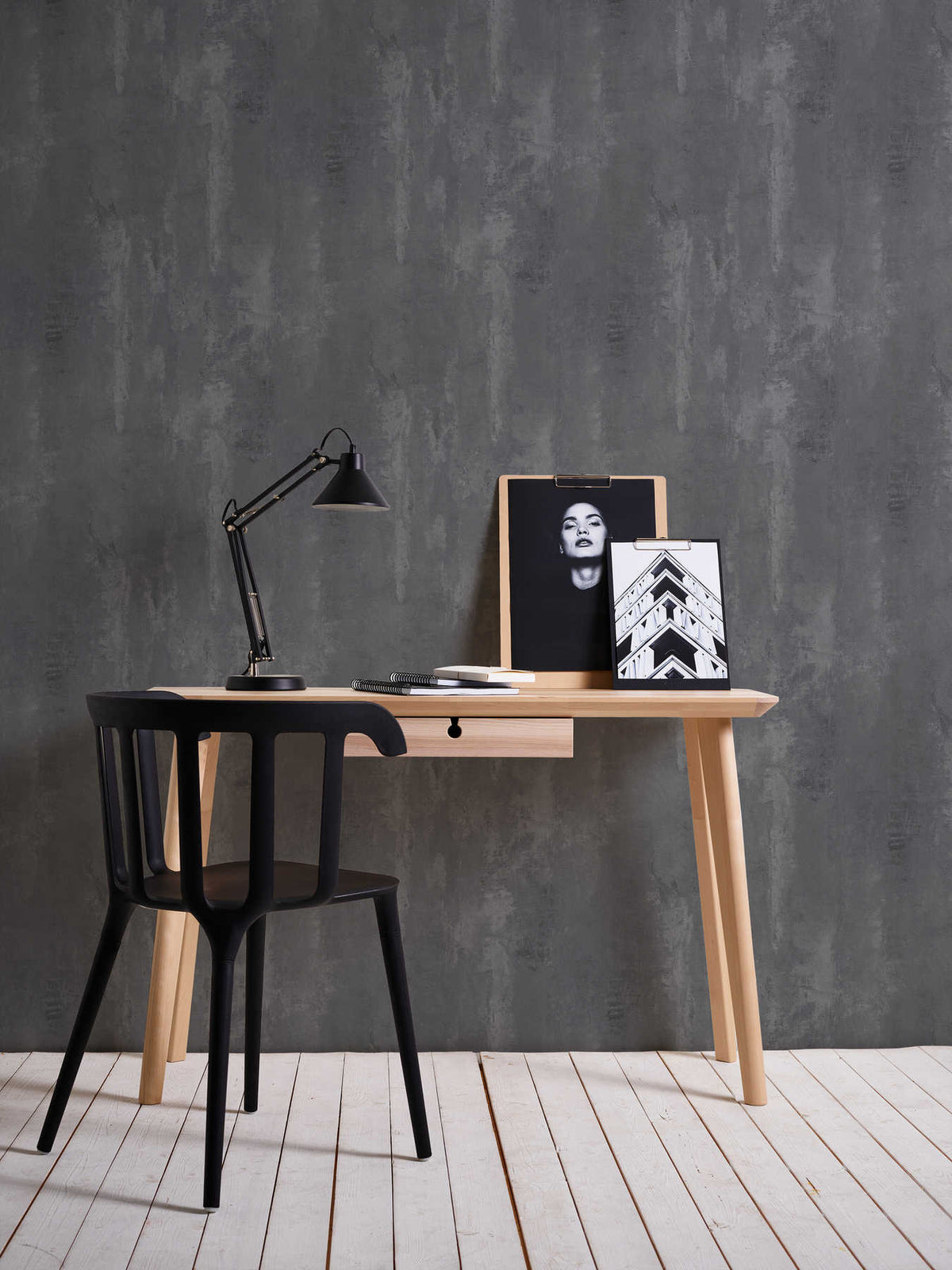 The Basalt Foundry | Charcoal Slate Luxe wallpaper behind a timber desk with a black chair and task lamp in a home office