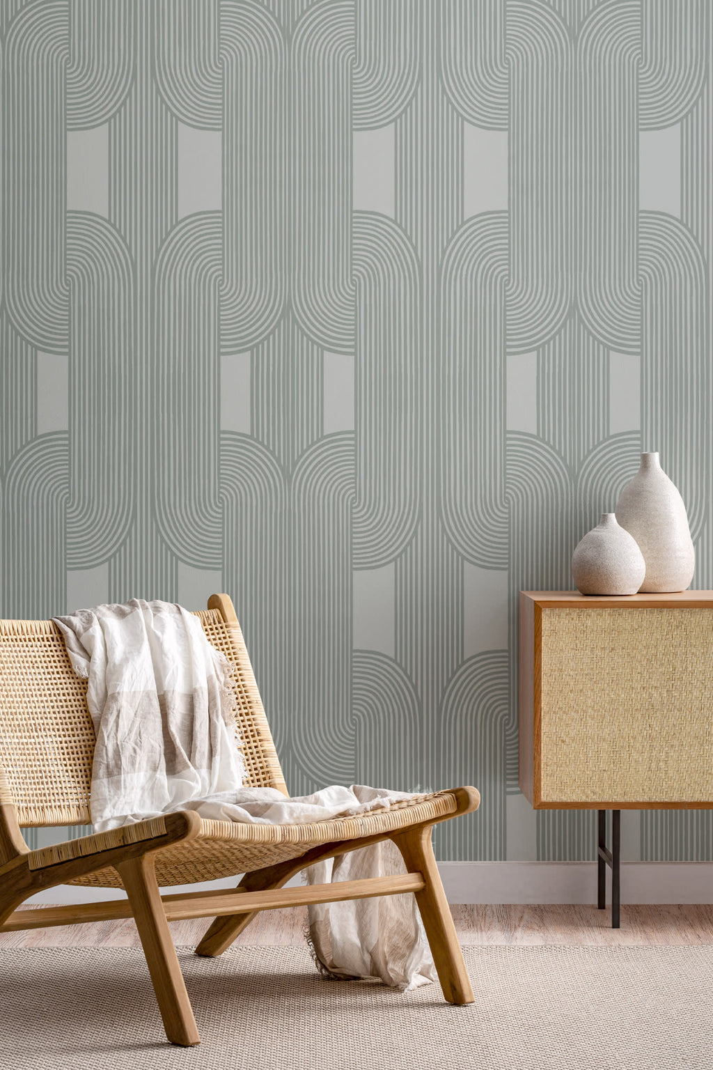 The Arcade Curve wallpaper in soft sage in a living room