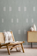 The Arcade Curve wallpaper in soft sage in a living room