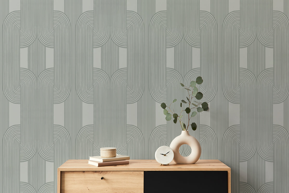 The Arcade Curve wallpaper in soft sage behind a styled console