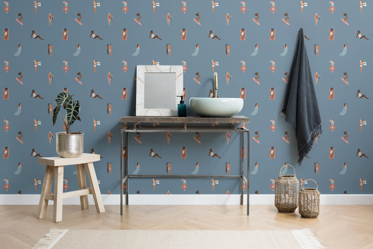 The Bathing Promenade wallpaper in dusk blue in a study corner with a desk