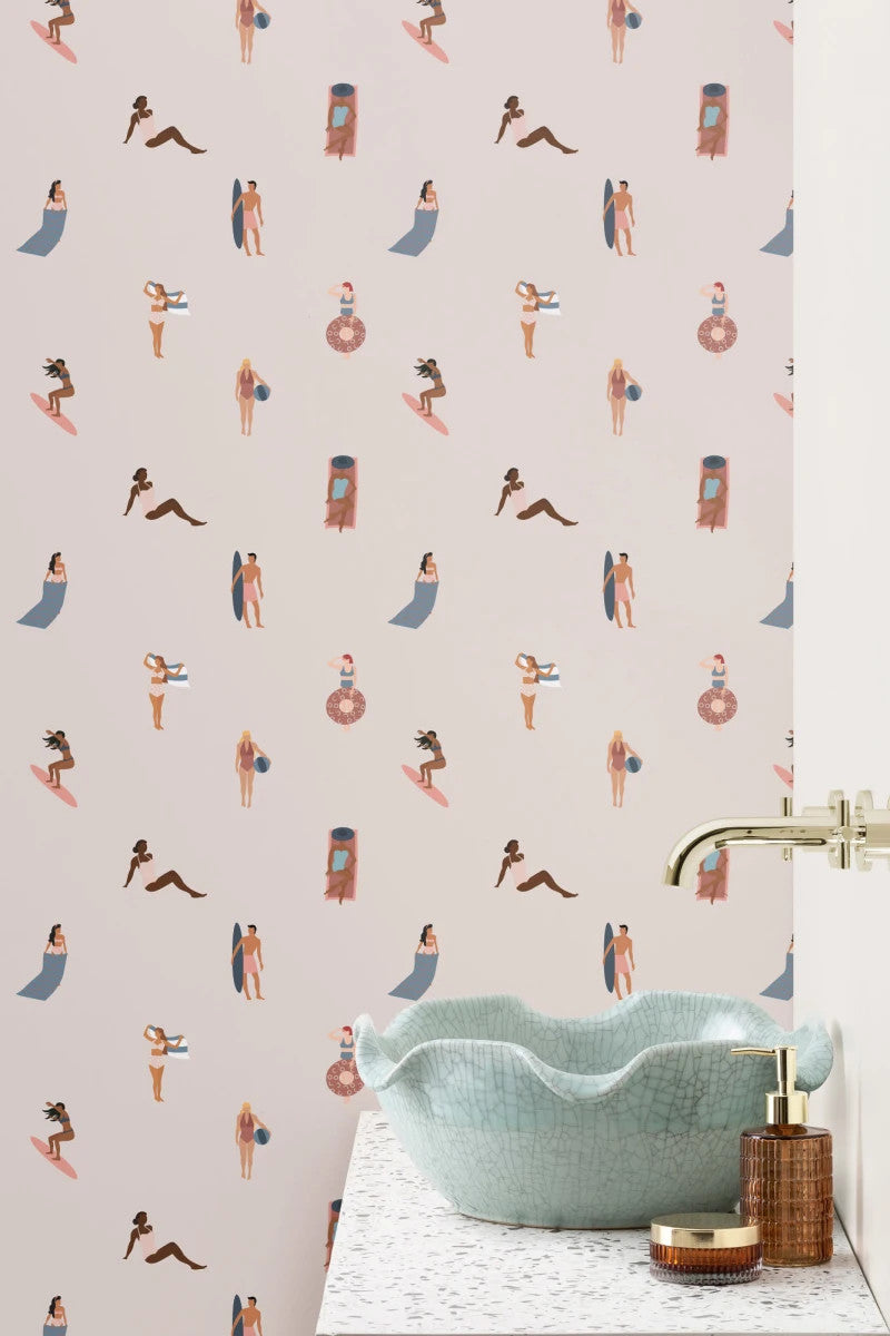 The Bathing Promenade wallpaper in shell pink and cream behind a bathroom vanity