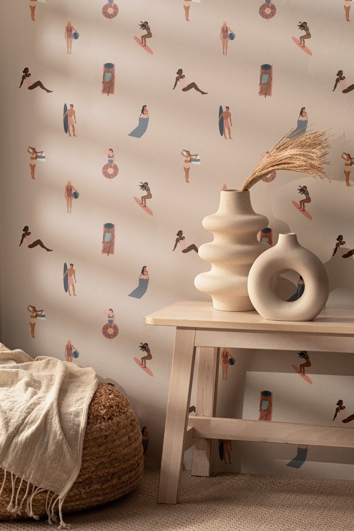 The Bathing Promenade wallpaper in shell pink and cream behind a styled console