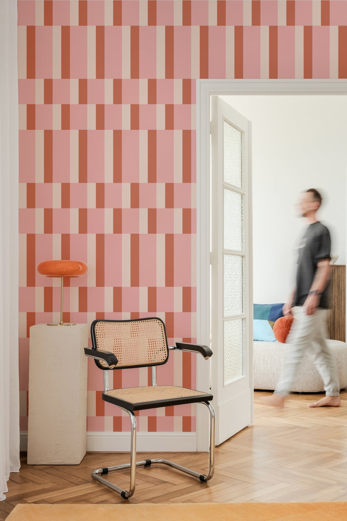 The Bauhaus Block wallpaper in rose and tangerine in a hallway