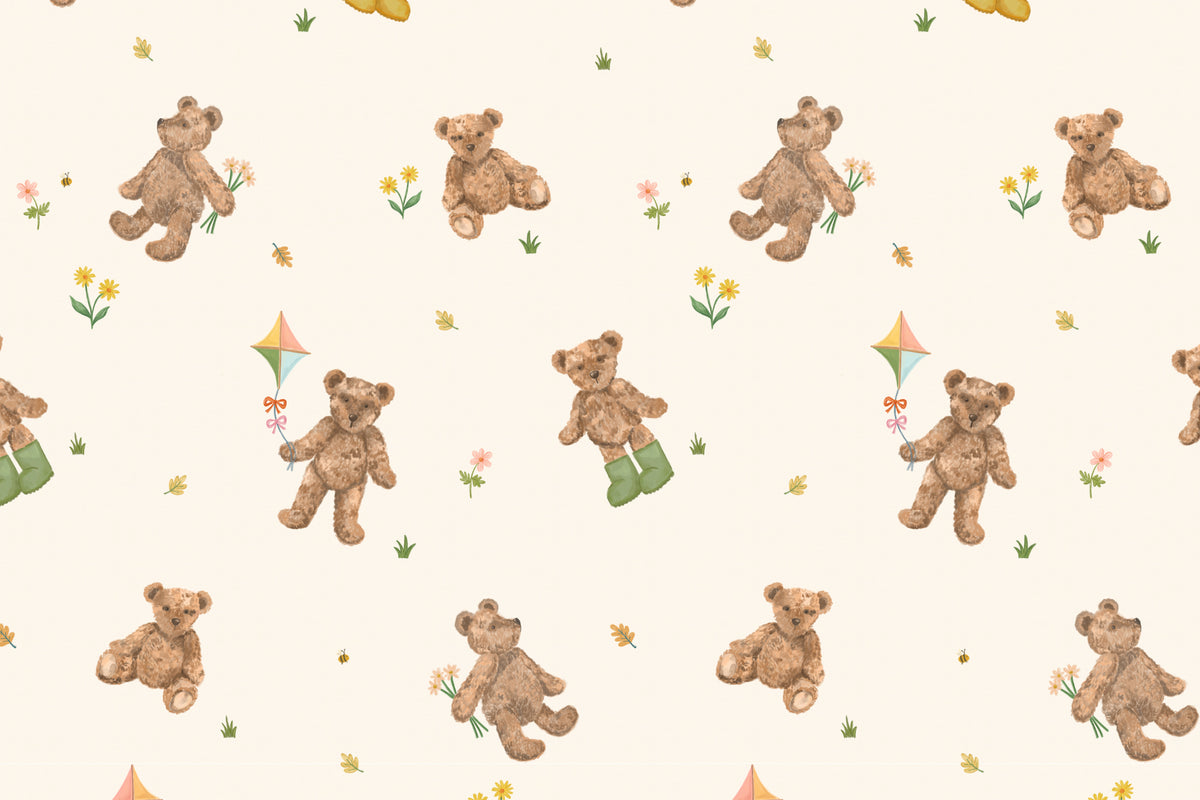 Flat pattern view of The Bear Parlour wallpaper in cream and caramel, showing the tumbling teddy bears