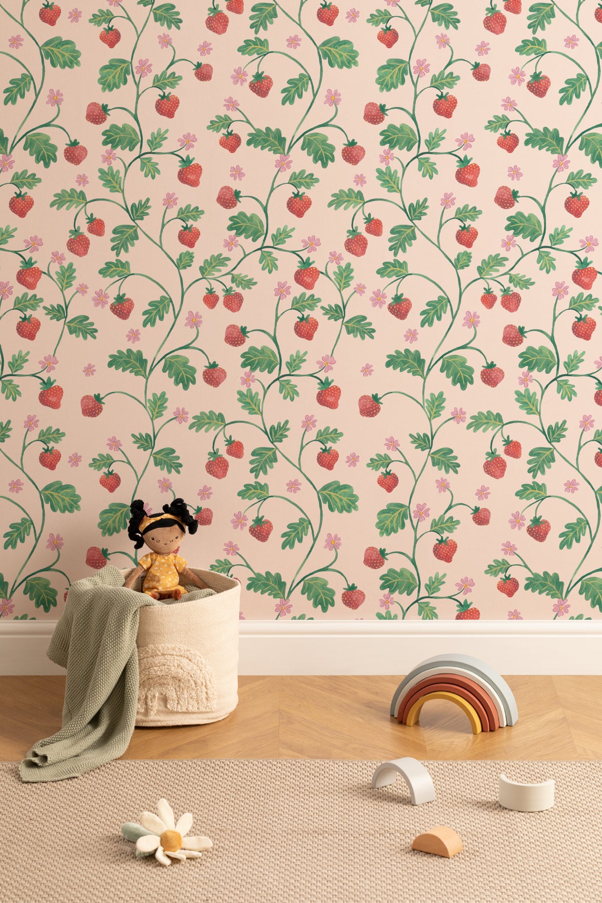 The Berry Arbour wallpaper in blush beige behind a styled console