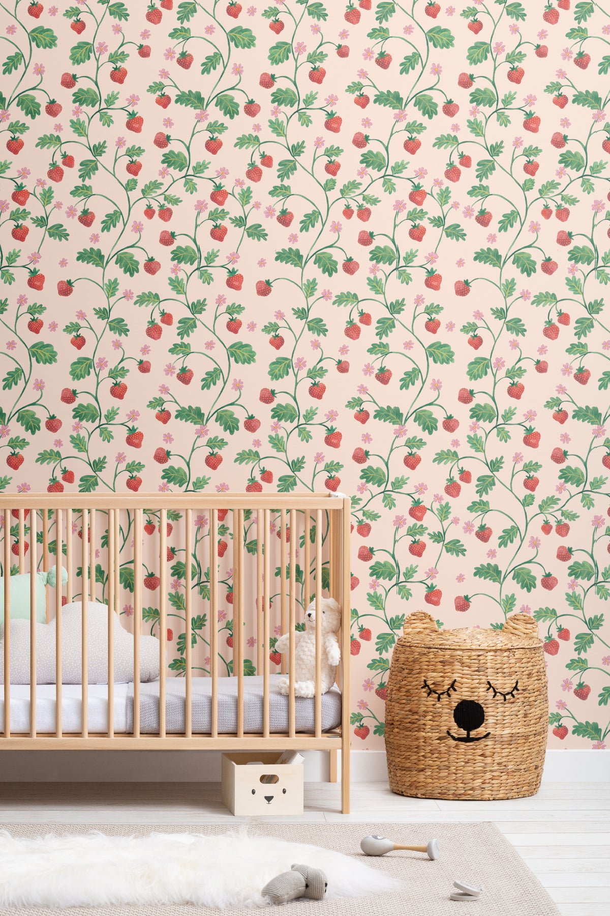 The Berry Arbour wallpaper in blush beige on a nursery wall