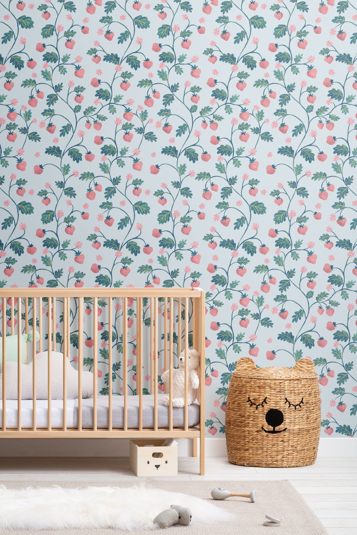 The Berry Arbour wallpaper in pale sky blue on a nursery wall