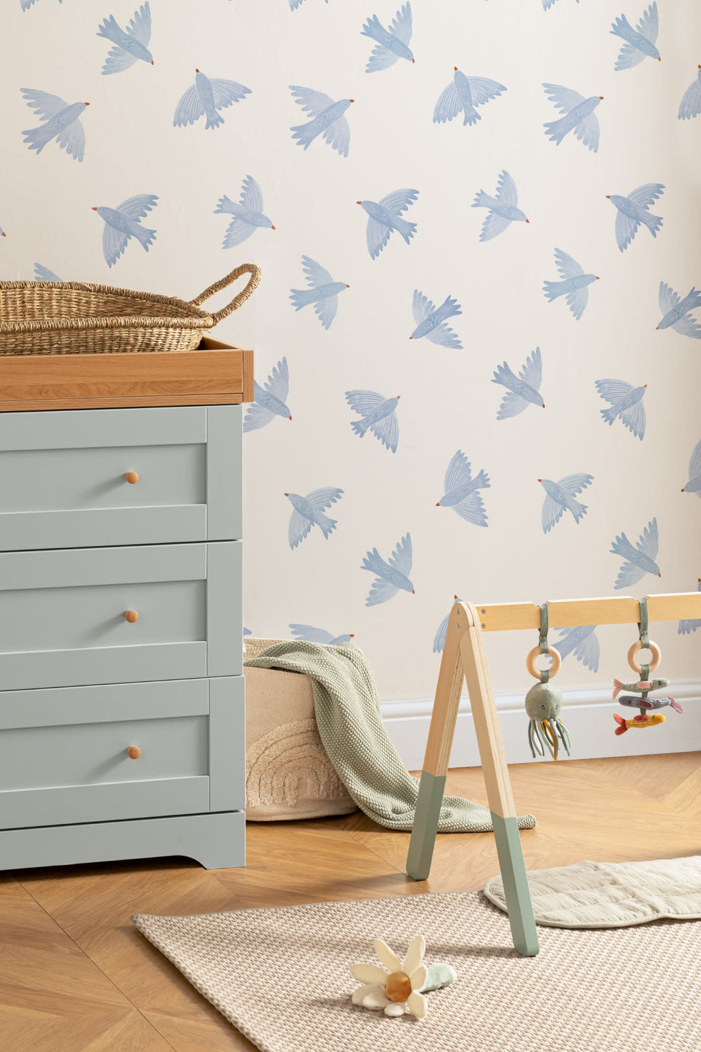 The Bluebird Flight wallpaper in cornflower blue behind a styled console