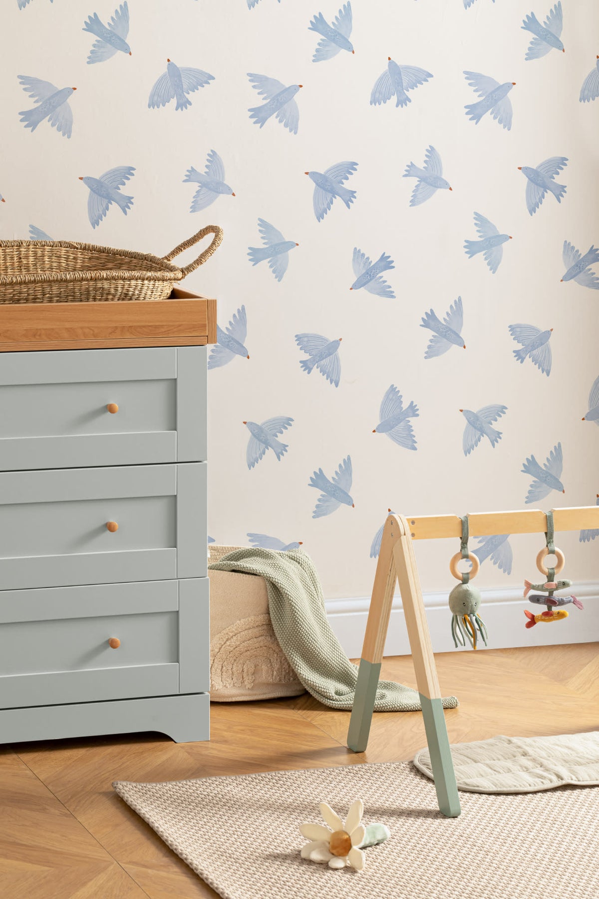 The Bluebird Flight wallpaper in cornflower blue behind a styled console