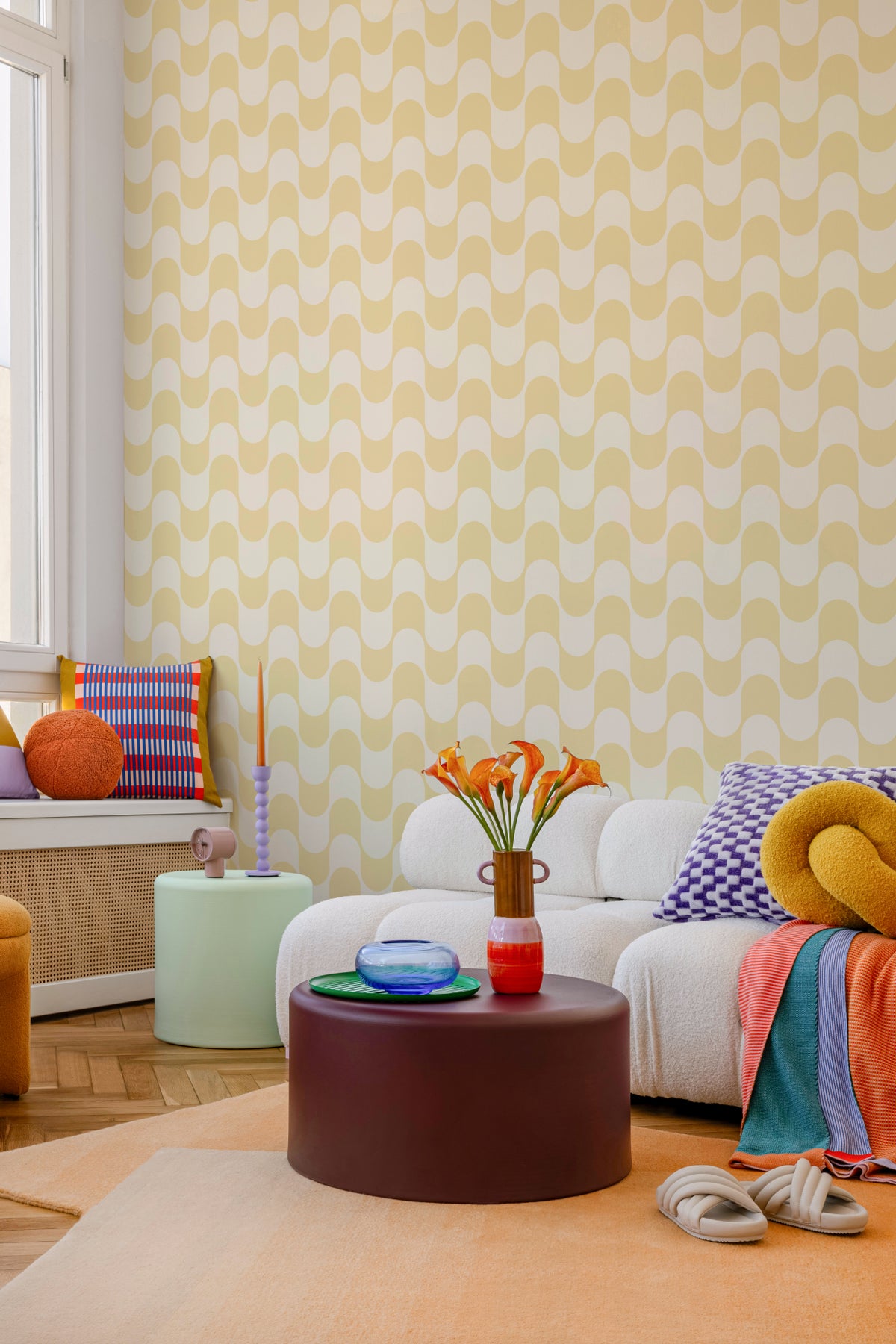 The Boardwalk Wave wallpaper in butter yellow on a nursery wall