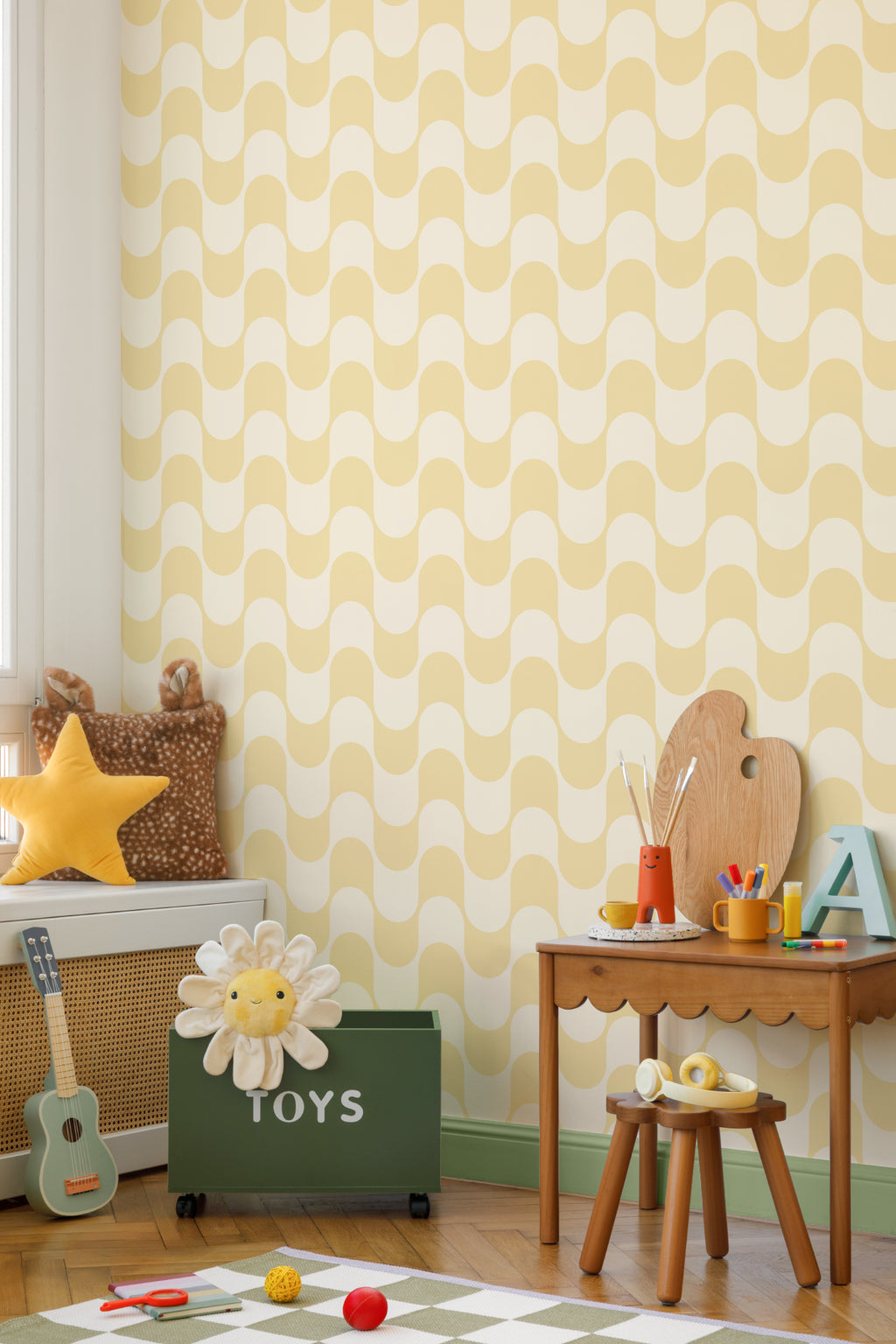 The Boardwalk Wave wallpaper in butter yellow in a child's bedroom