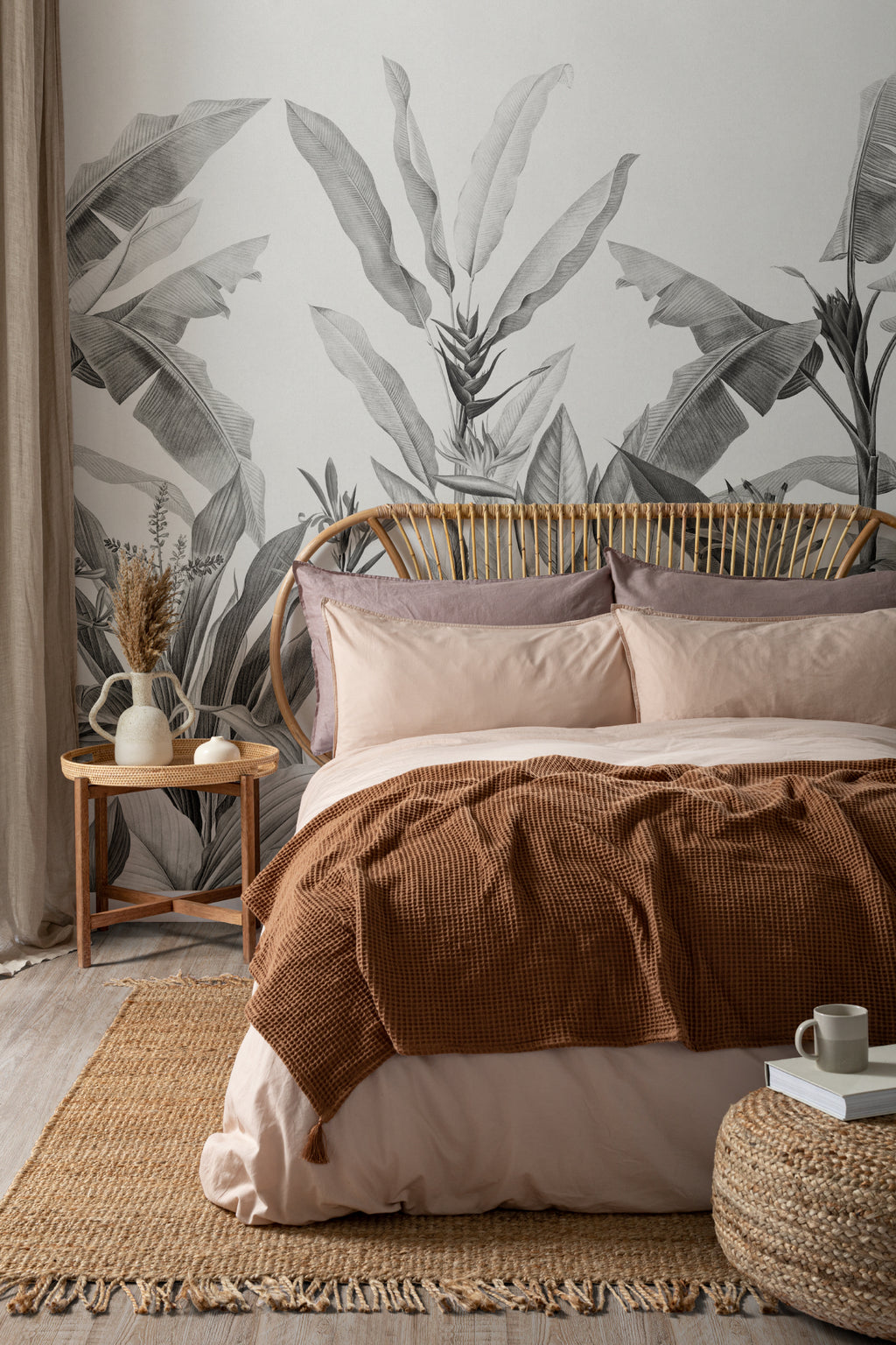 The Botanic Frieze mural in charcoal and white behind the bed in a bedroom