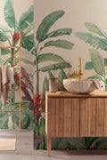 The Botanic Frieze mural in tropical green behind a styled console