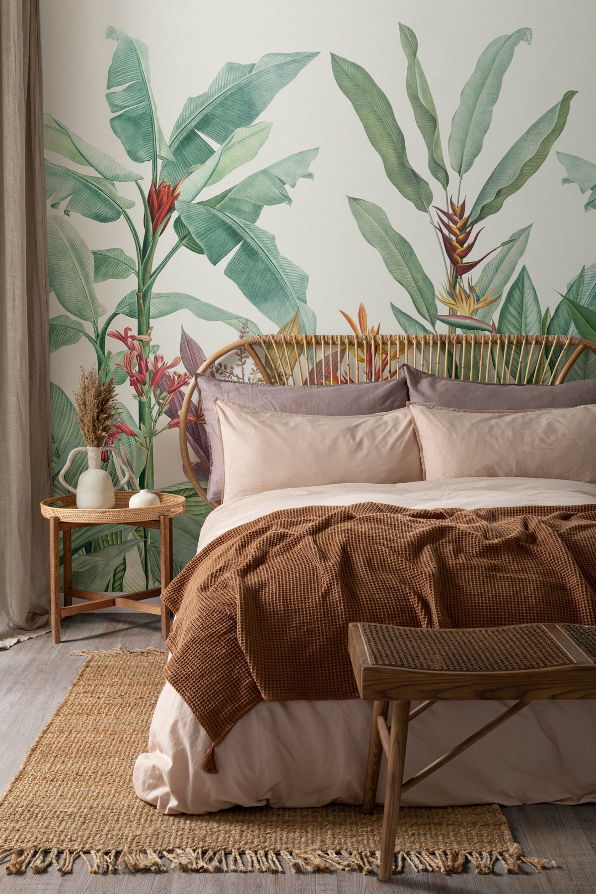 The Botanic Frieze mural in tropical green behind the bed in a bedroom
