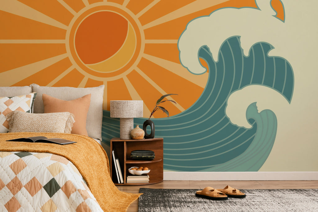 The Breakwater Sun mural in tangerine and teal behind the bed in a bedroom