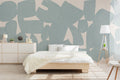 The Brushed Fragments mural in seafoam blue behind the bed in a bedroom