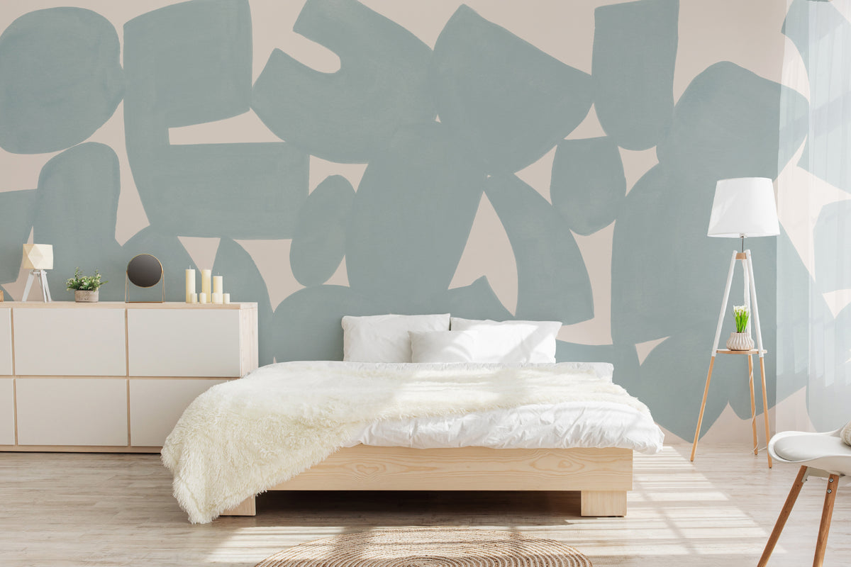 The Brushed Fragments mural in seafoam blue behind the bed in a bedroom