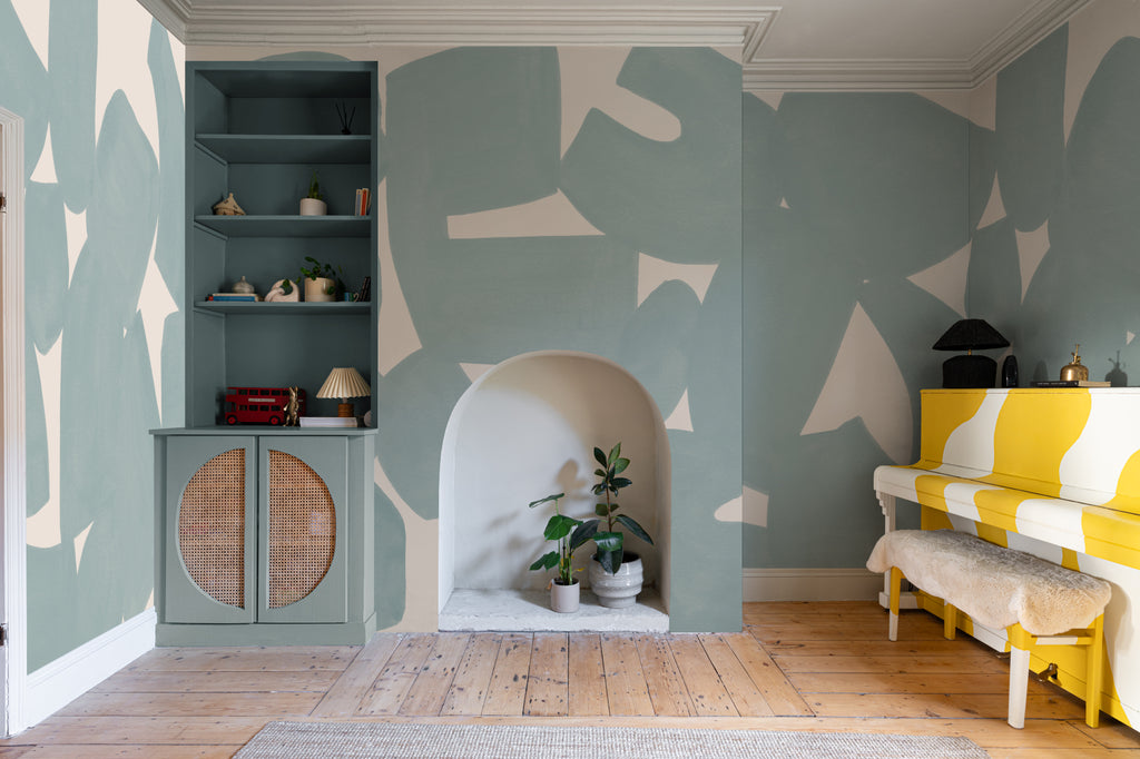 The Brushed Fragments mural in seafoam blue in a living room