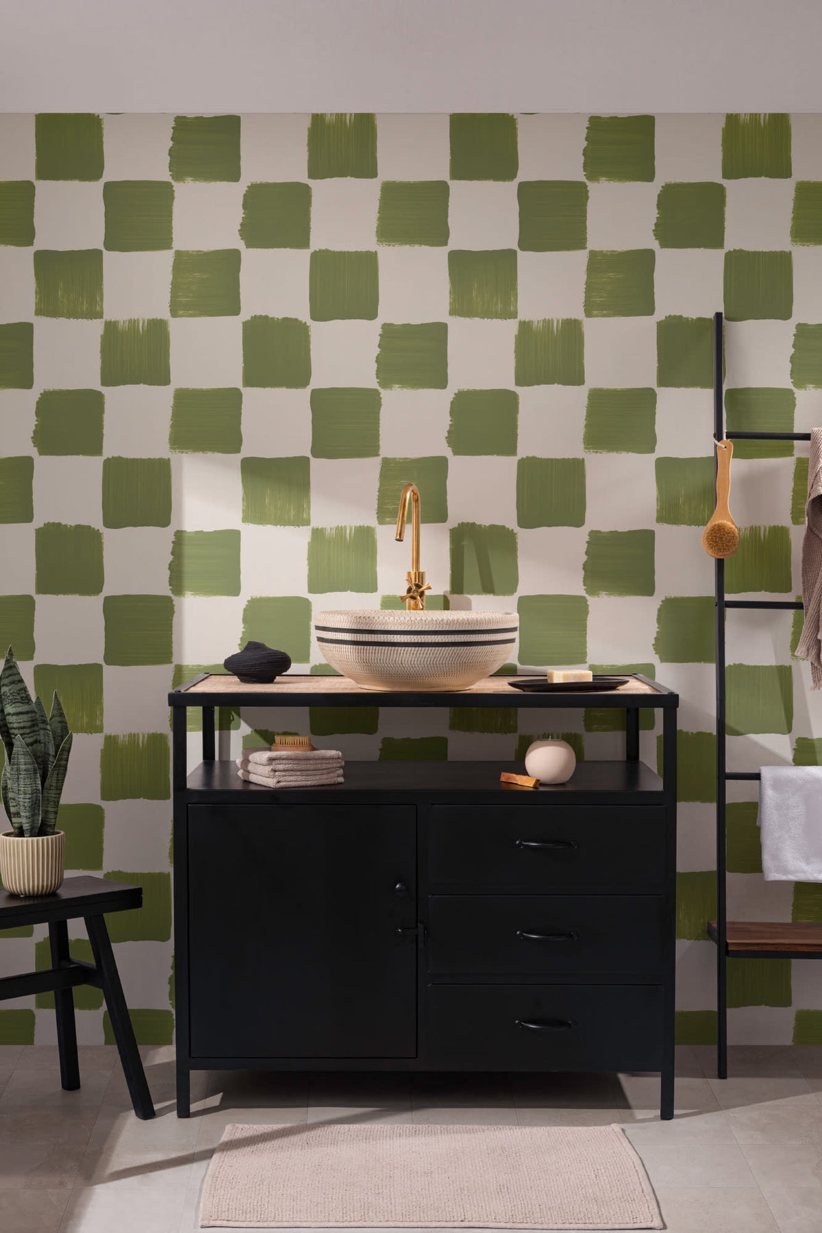 The Brushstroke Chequer wallpaper in olive moss behind a styled console