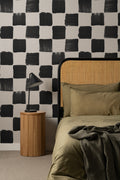 The Brushstroke Chequer wallpaper in onyx and beige in a living room