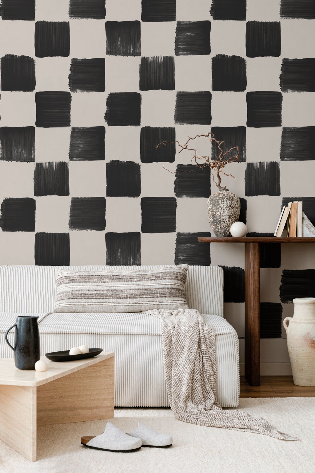 The Brushstroke Chequer wallpaper in onyx and beige behind the bed in a bedroom