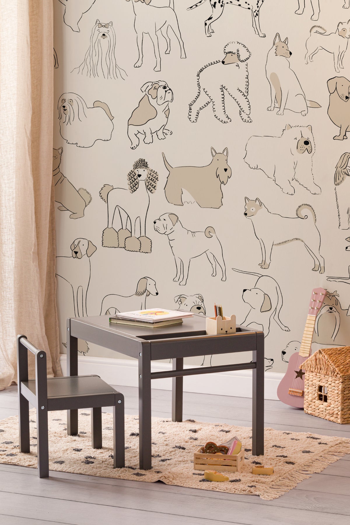 The Canine Portraits mural in oat and cream behind a kids' play corner