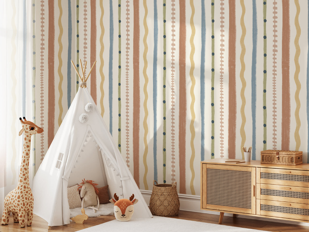 The Carousel Stripe mural in mustard and sky blue behind a kids' play corner