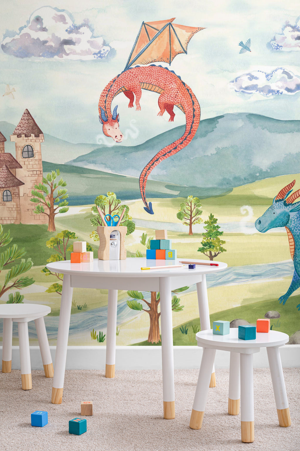 The Castle Storybook mural in dawn blue and meadow green on a nursery wall