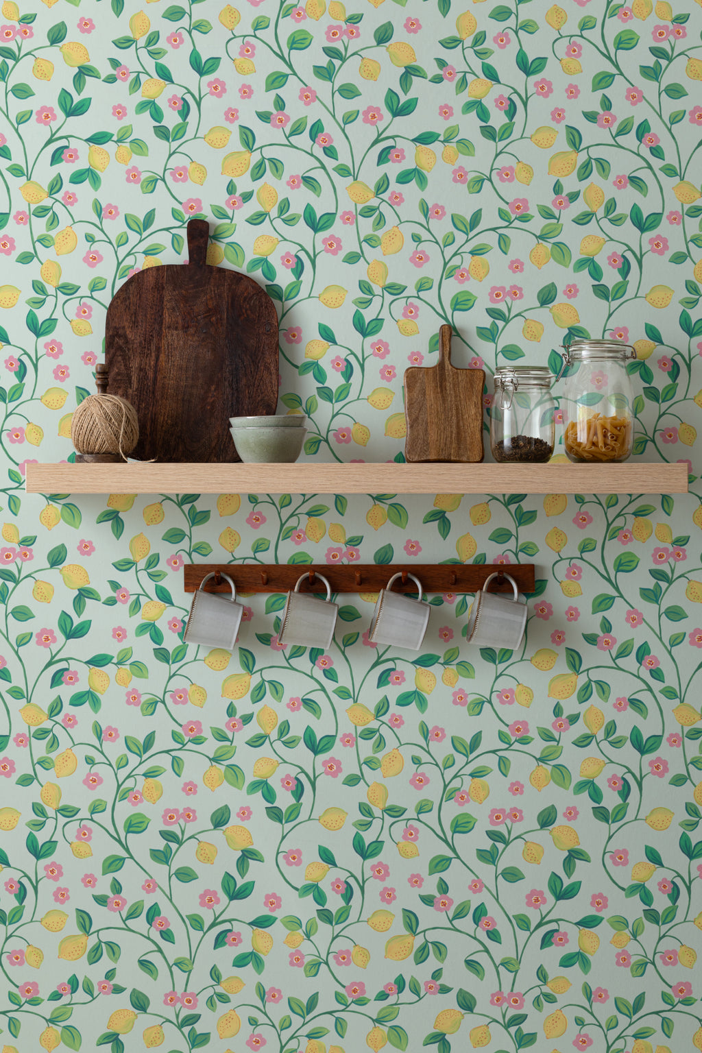 The Citrus Grove wallpaper in pale aqua behind a styled console