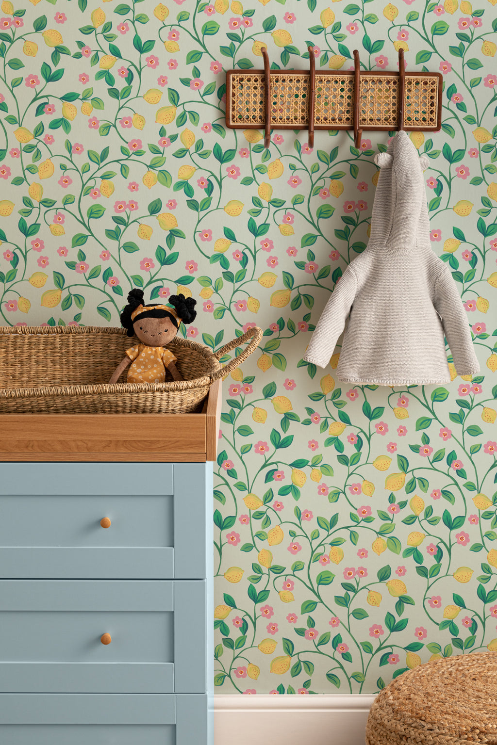 The Citrus Grove wallpaper in pale aqua on a nursery wall