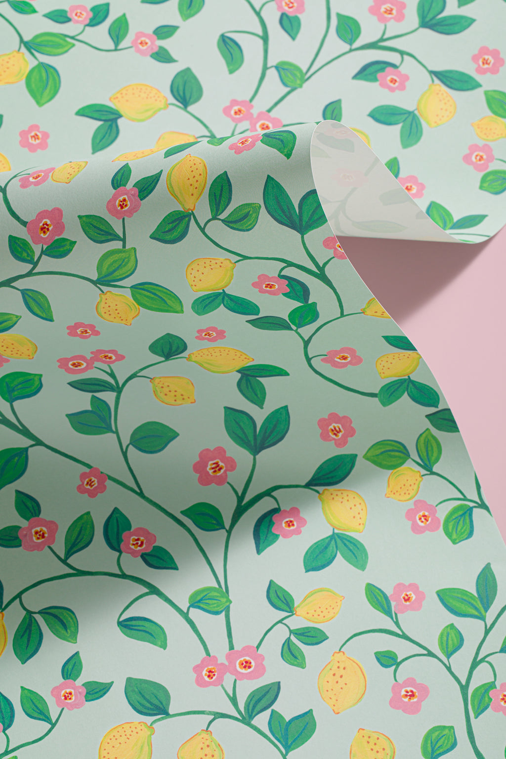 Angled detail of The Citrus Grove wallpaper in pale aqua