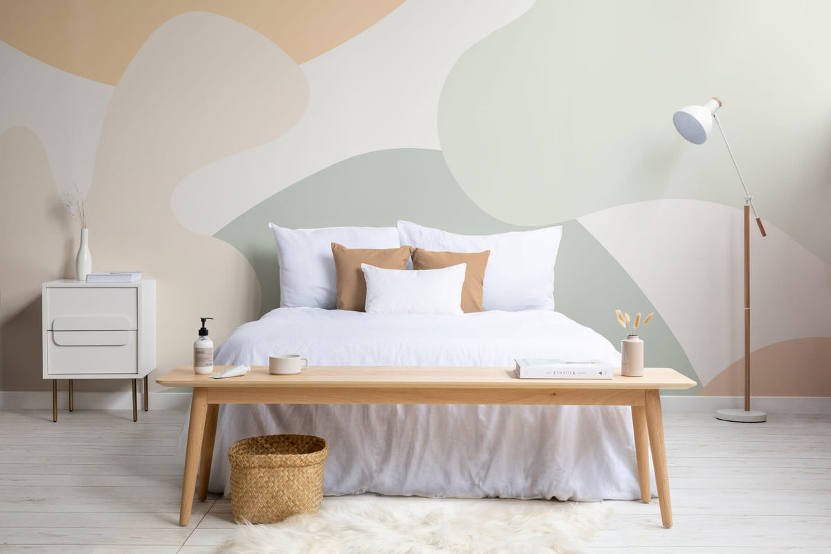 The Cloud Hills mural in sage and apricot behind the bed in a bedroom