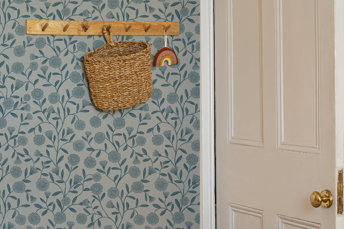 The Cottage Daisy wallpaper in denim blue in an entryway