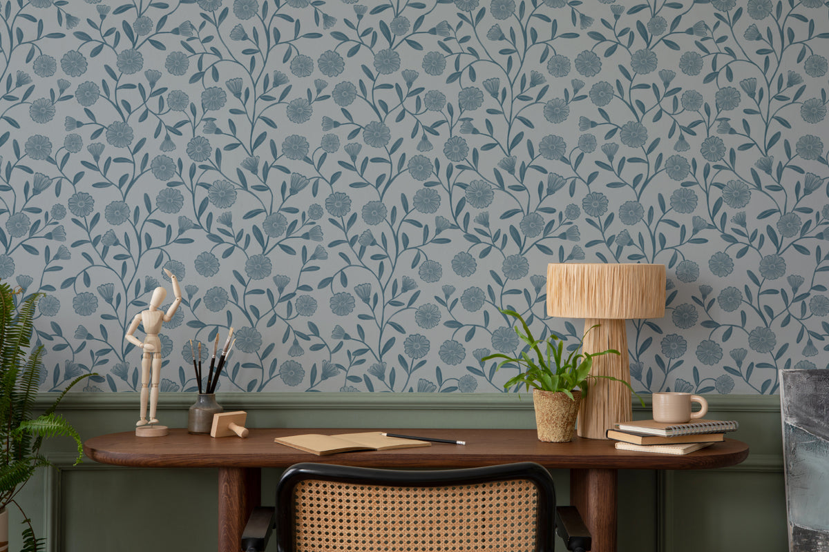 The Cottage Daisy wallpaper in denim blue behind a desk in a home office