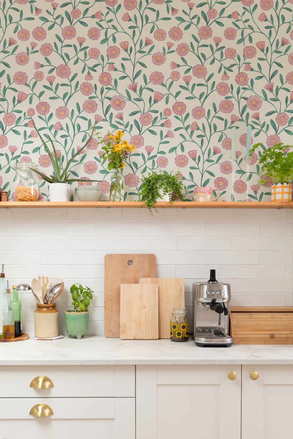 The Cottage Daisy wallpaper in rose pink in a kitchen