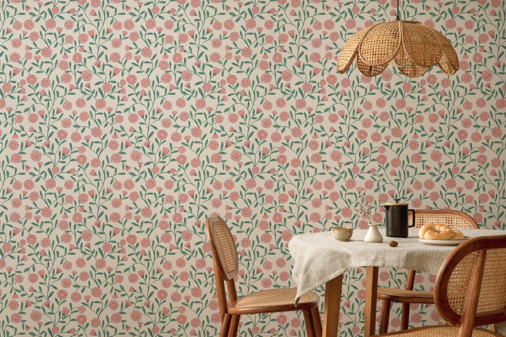 The Cottage Daisy wallpaper in rose pink behind a dining table