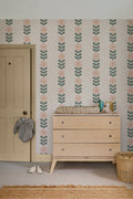 The Daisy Colonnade wallpaper in blush and oat behind a styled console
