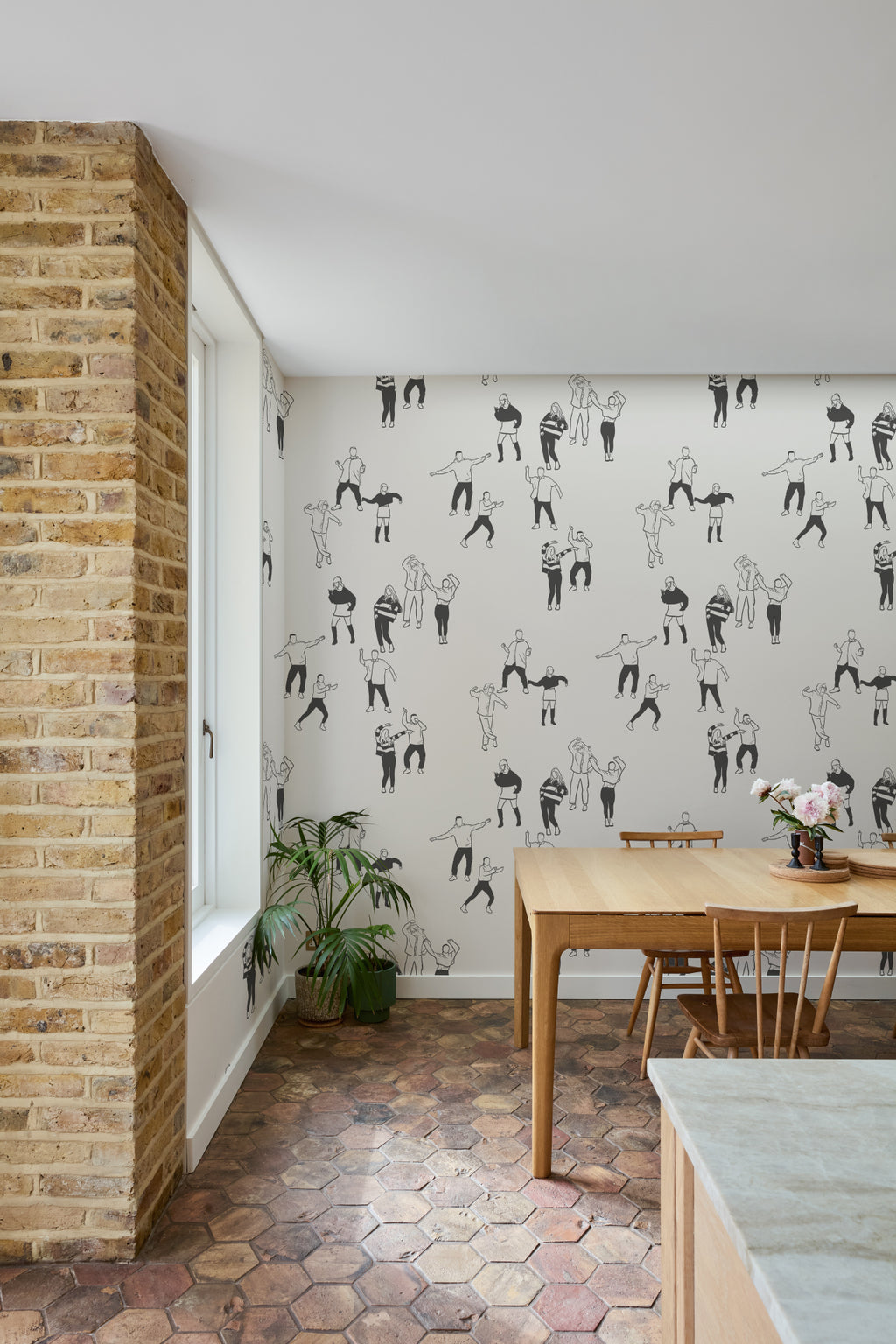 The Dancehall Sketch wallpaper in ink black and cream in a study corner with a desk