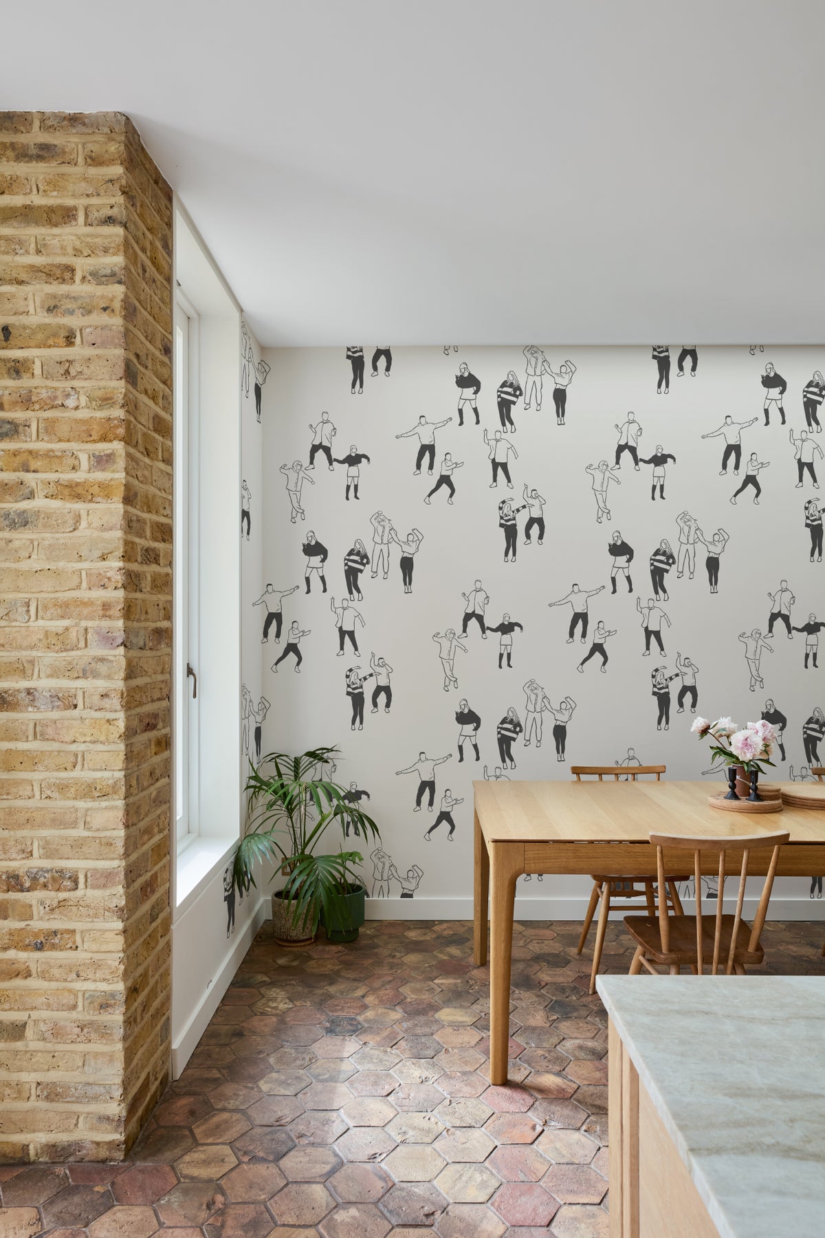 The Dancehall Sketch wallpaper in ink black and cream in a study corner with a desk