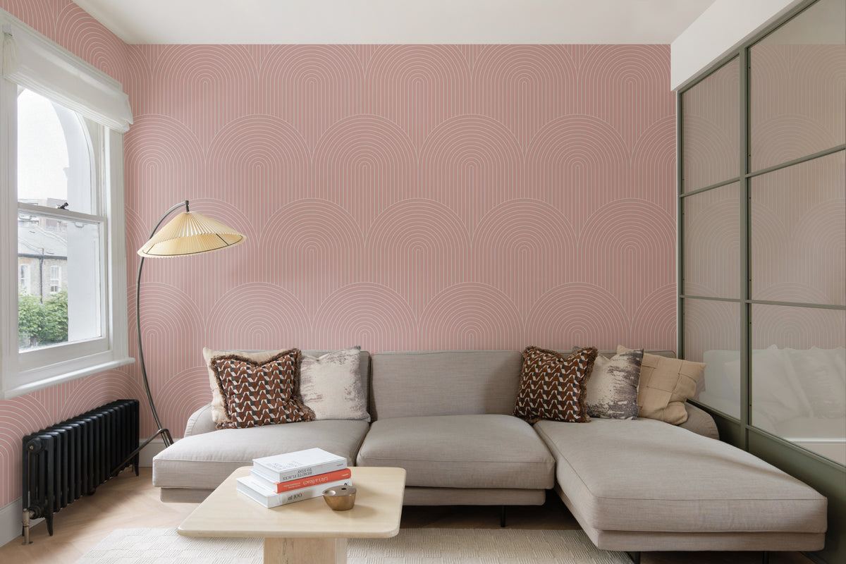 The Deco Archway wallpaper in dusty rose in a living room
