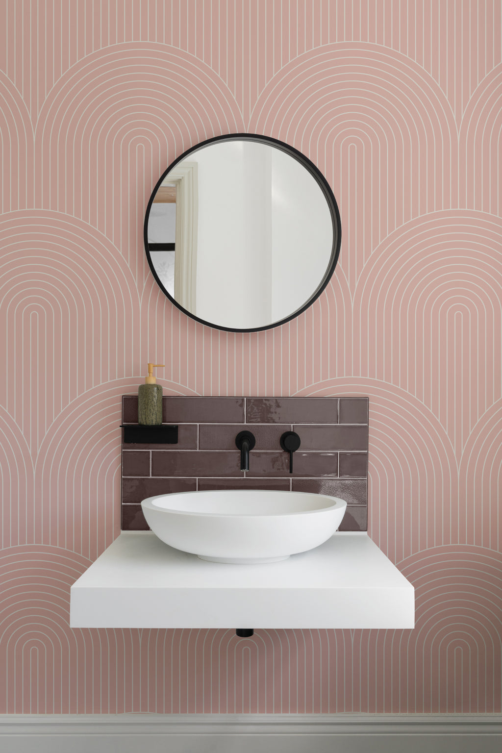 The Deco Archway wallpaper in dusty rose in a styled room setting