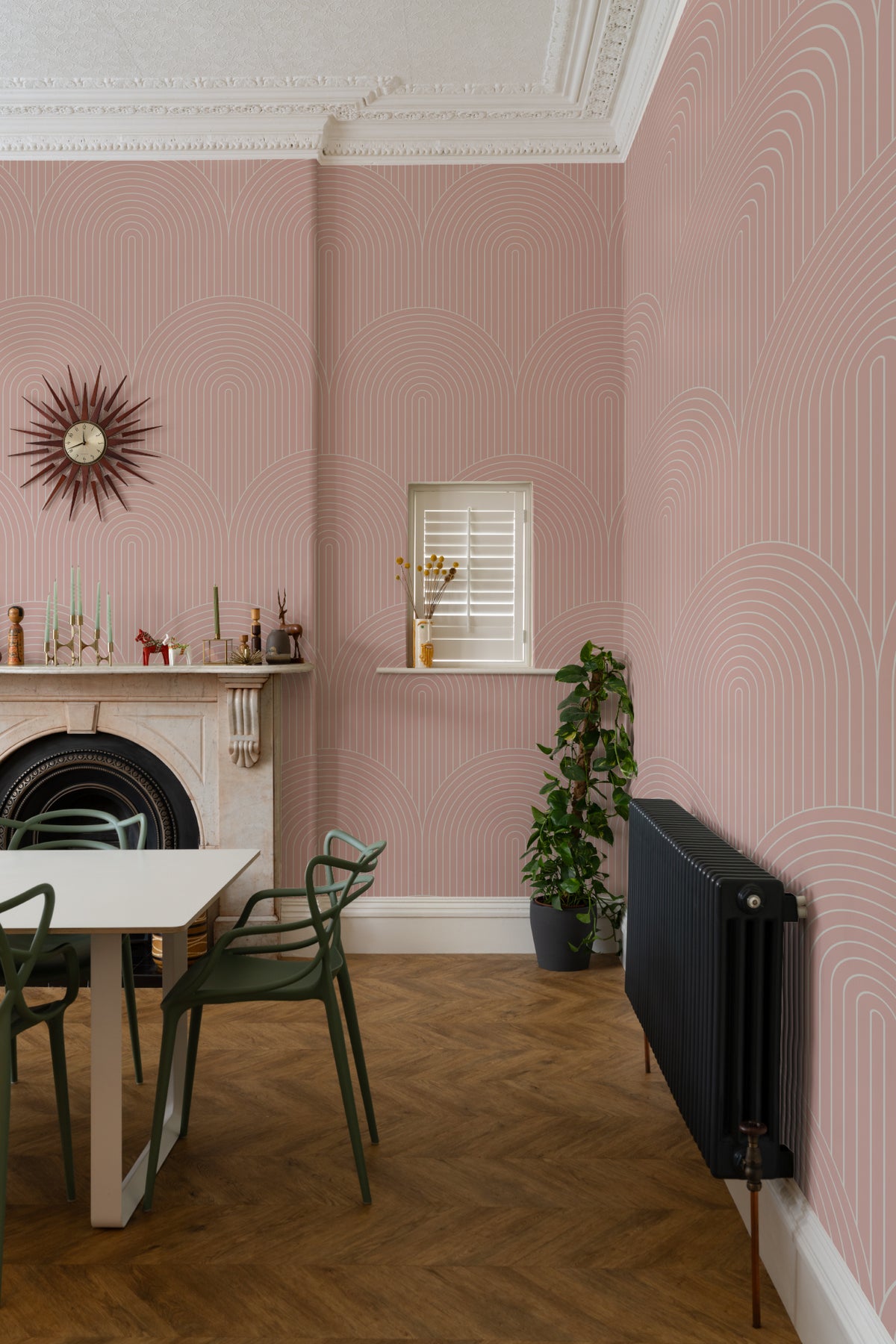 The Deco Archway wallpaper in dusty rose behind a desk in a home office
