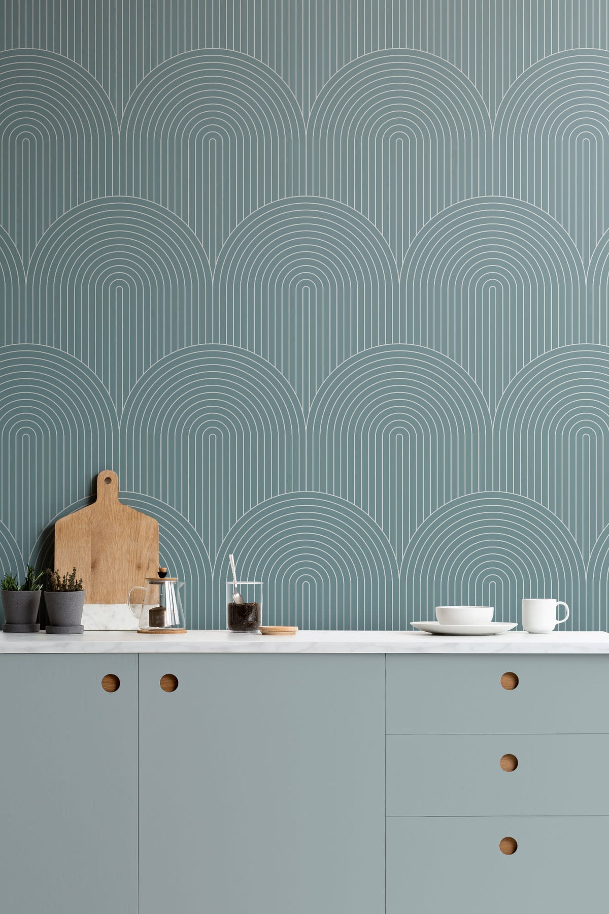 The Deco Archway wallpaper in teal green in a kitchen